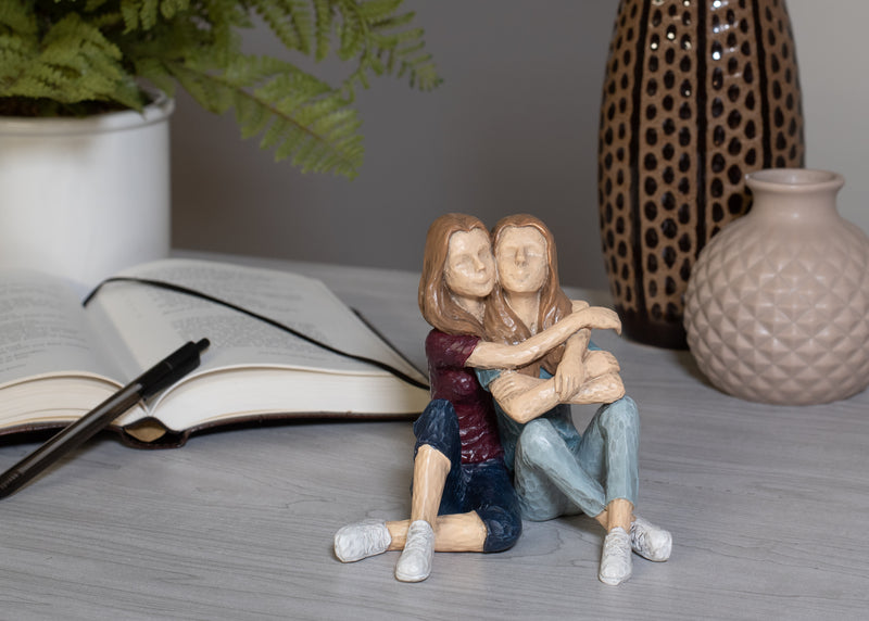 Embracing Sisters Sitting 5 x 5 Resin Decorative Tabletop Figurine